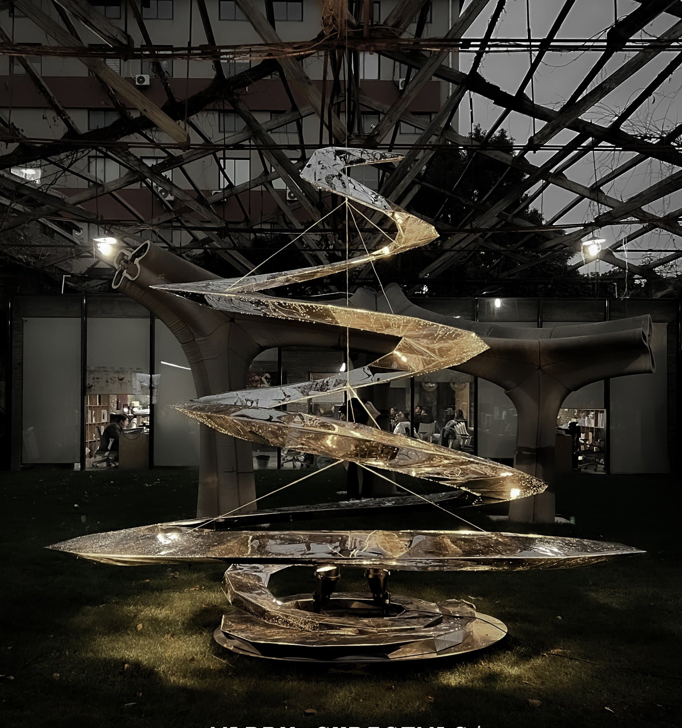 Installed metal Christmas tree sculpture at night in the Archi-Union atrium