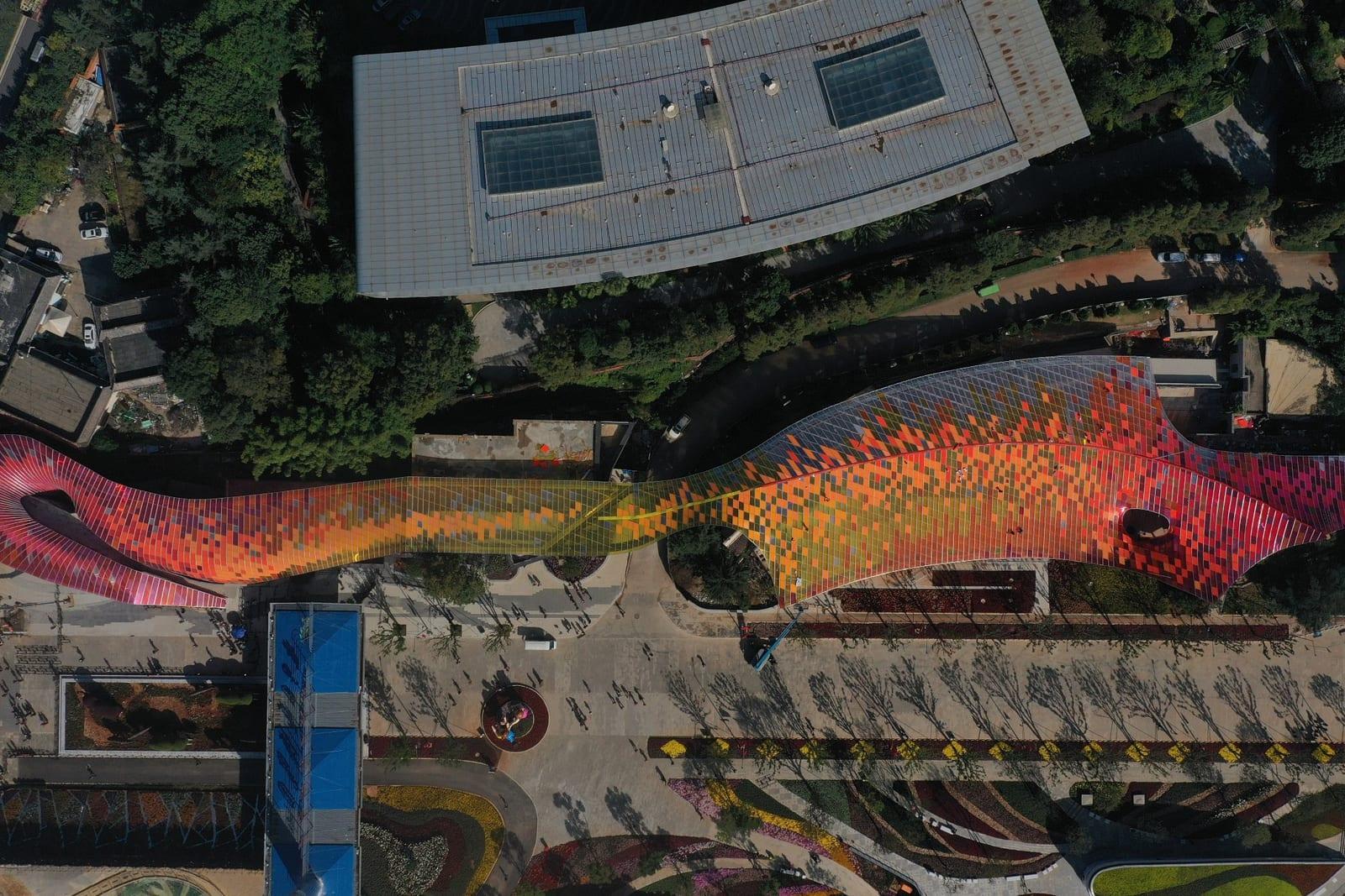 Aerial view of the colourful pixelated canopy winding through Kunming Expo Park