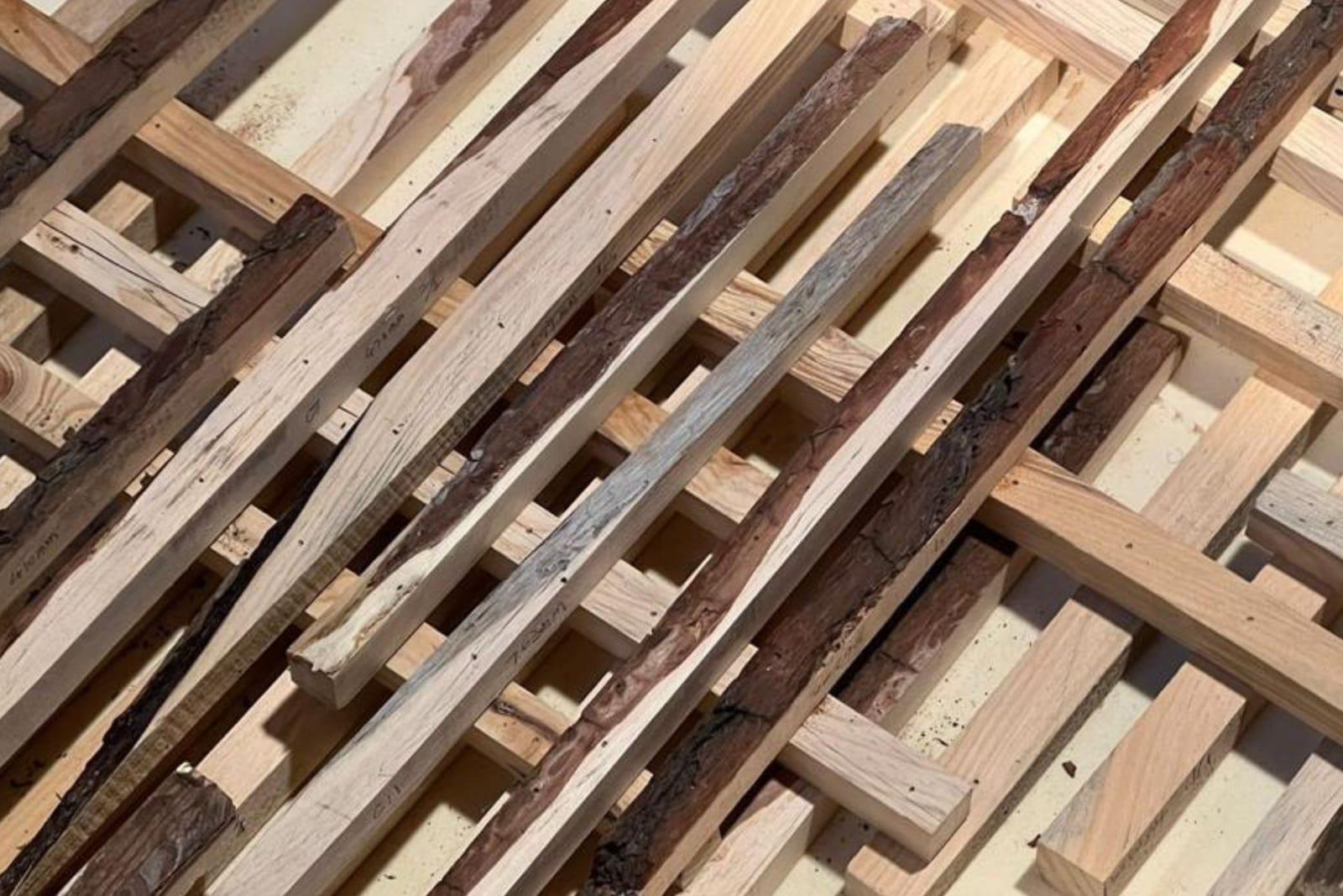 Robotic assembly of wood offcut sticks for the facade system