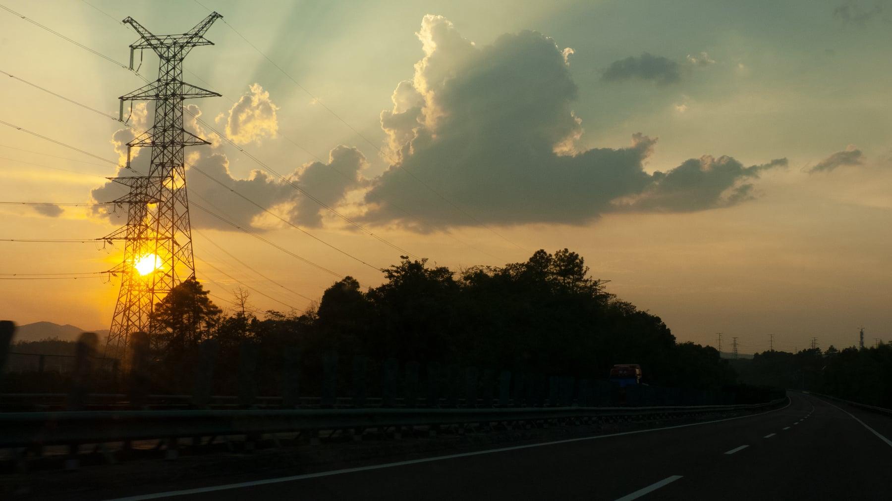 Sunset behind transmission towers
