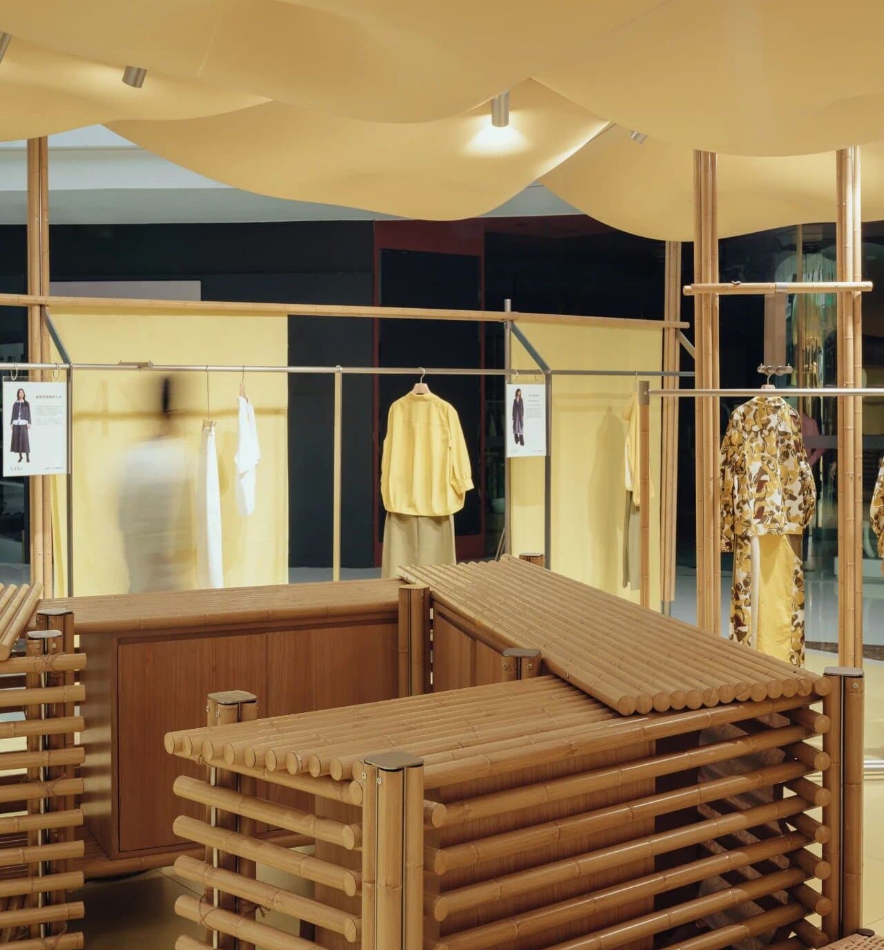 Inside the Lanxi Pavilion — bamboo-steel structure with yellow fabric enclosure