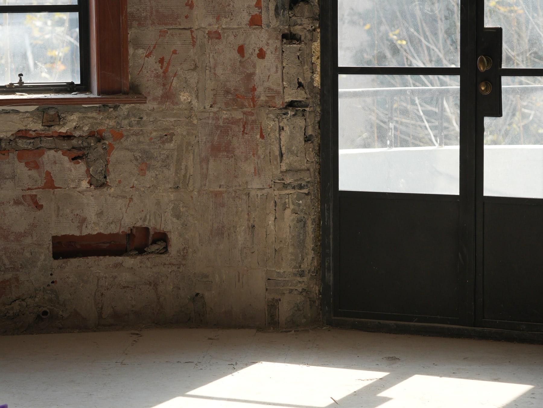 Window light falling across the stripped floor