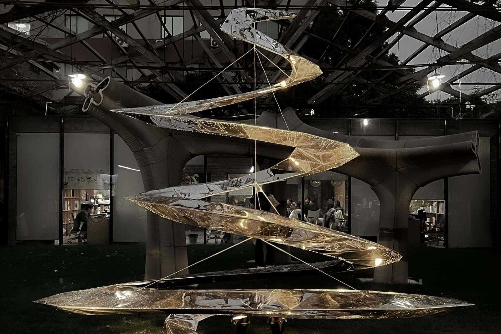 Installed metal Christmas tree sculpture at night in the Archi-Union atrium