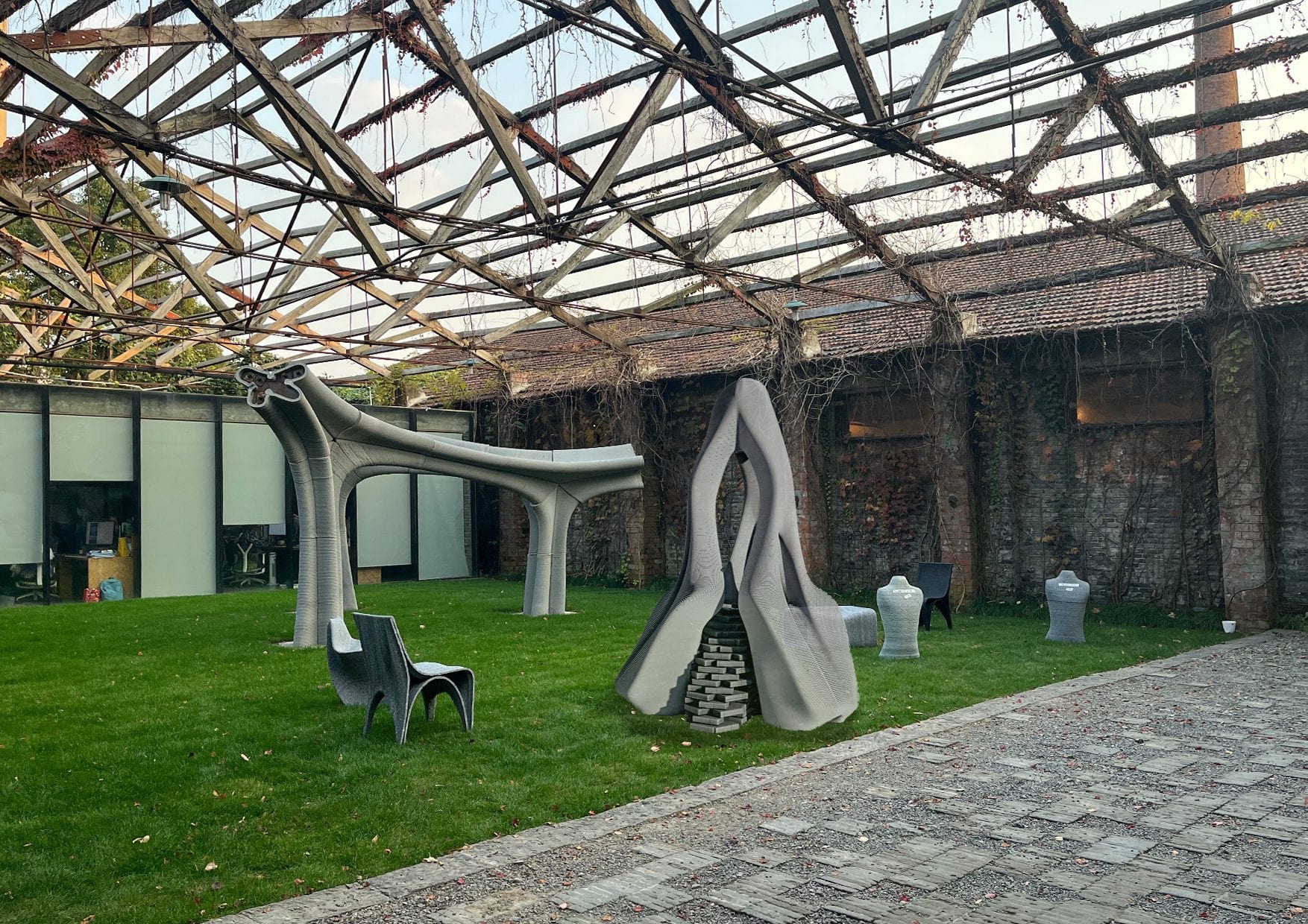 Concrete-printed folly installed in the courtyard beneath the bamboo-lath canopy