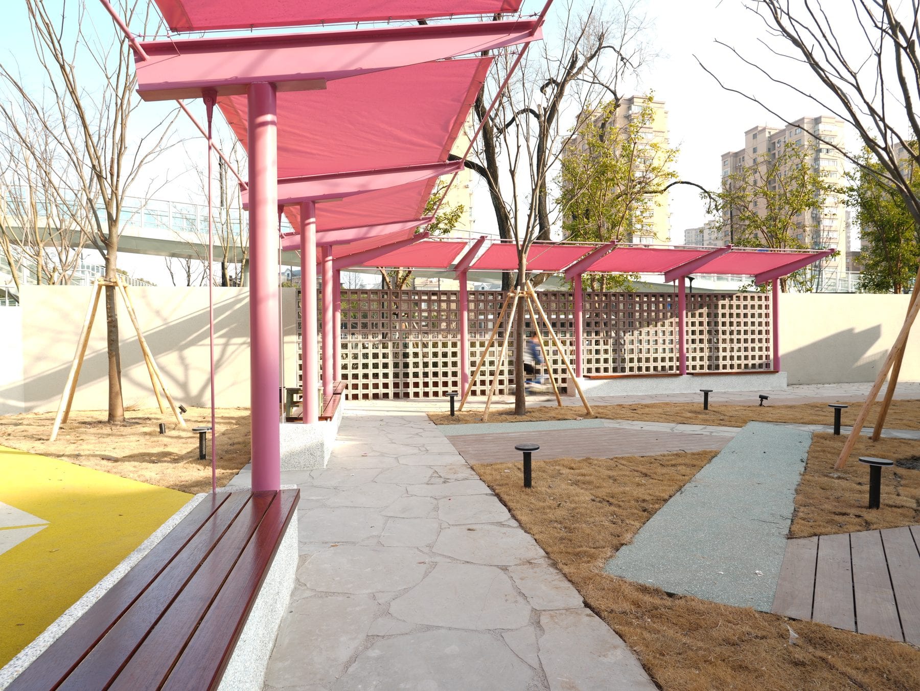 Pergola walkway with integrated bench edge