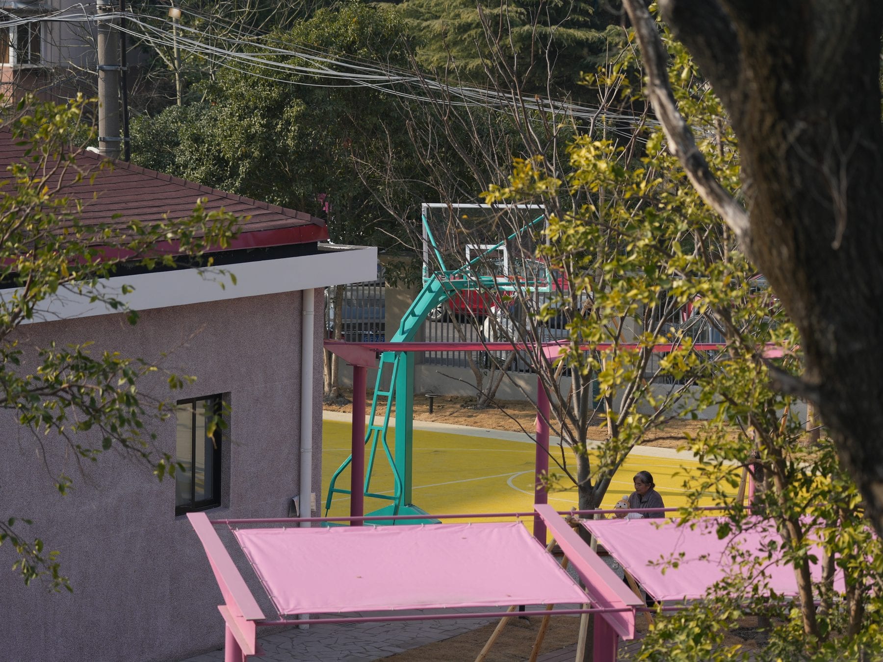 Pergola edge meeting the small basketball court
