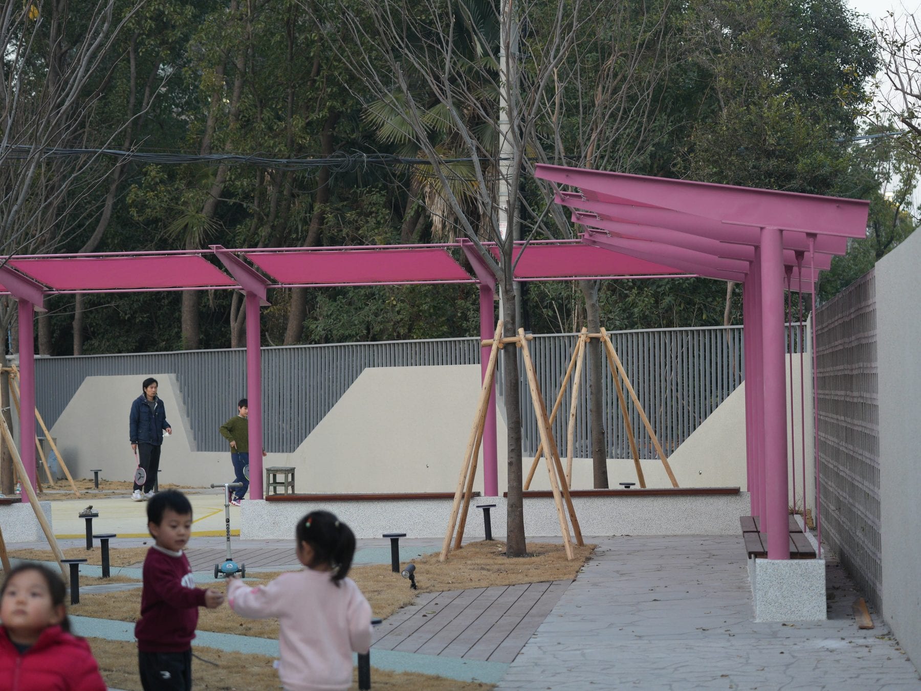 Children playing under the pergola