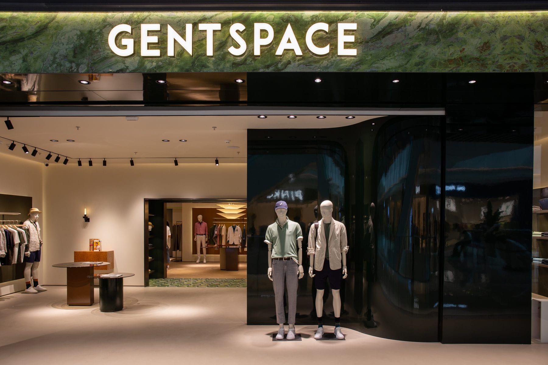 Wide view of the storefront with mannequin displays