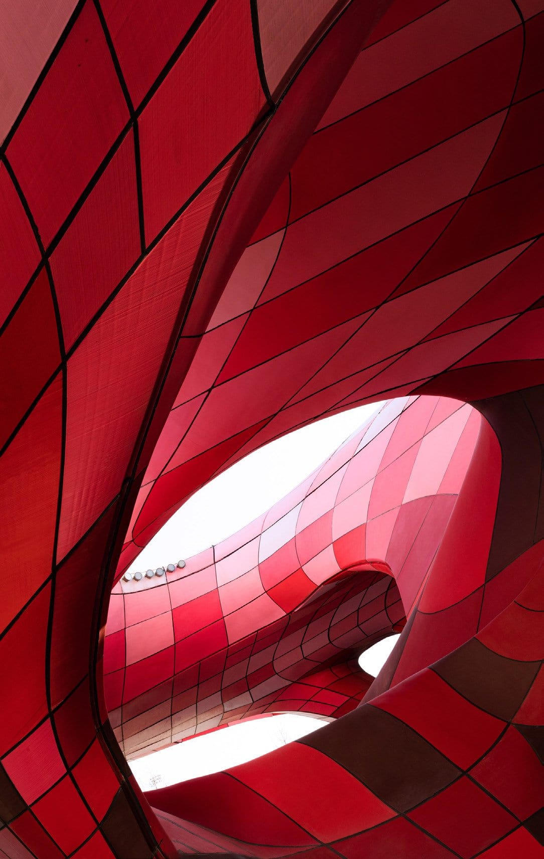 3D printed modified-plastic panels in six shades of red