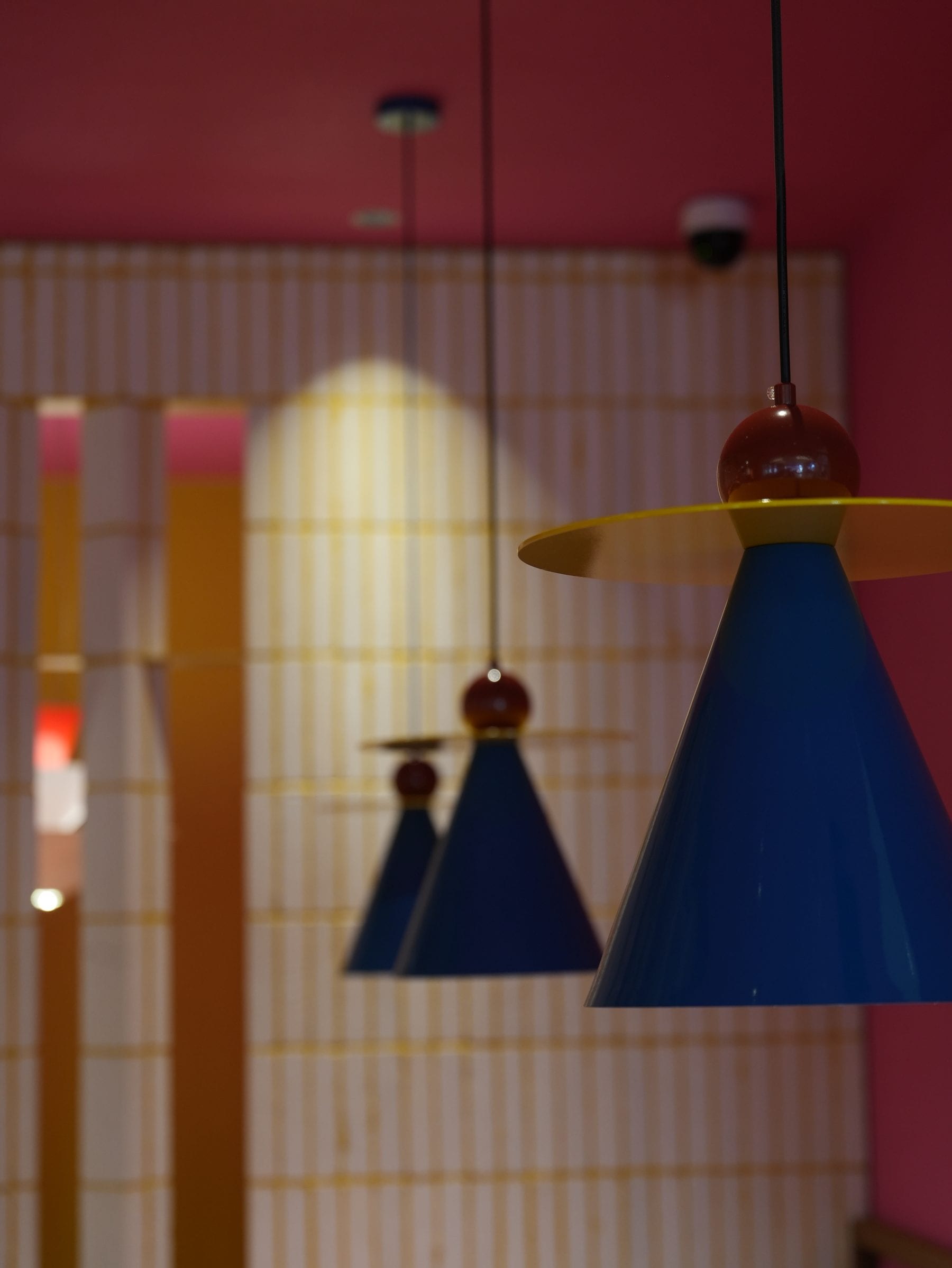 Close-up of the blue and ochre pendant lamps