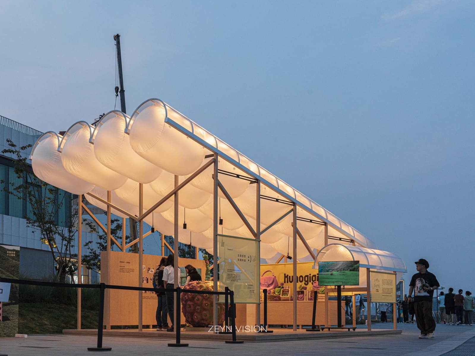 Wide dusk view of both pavilions on the promenade