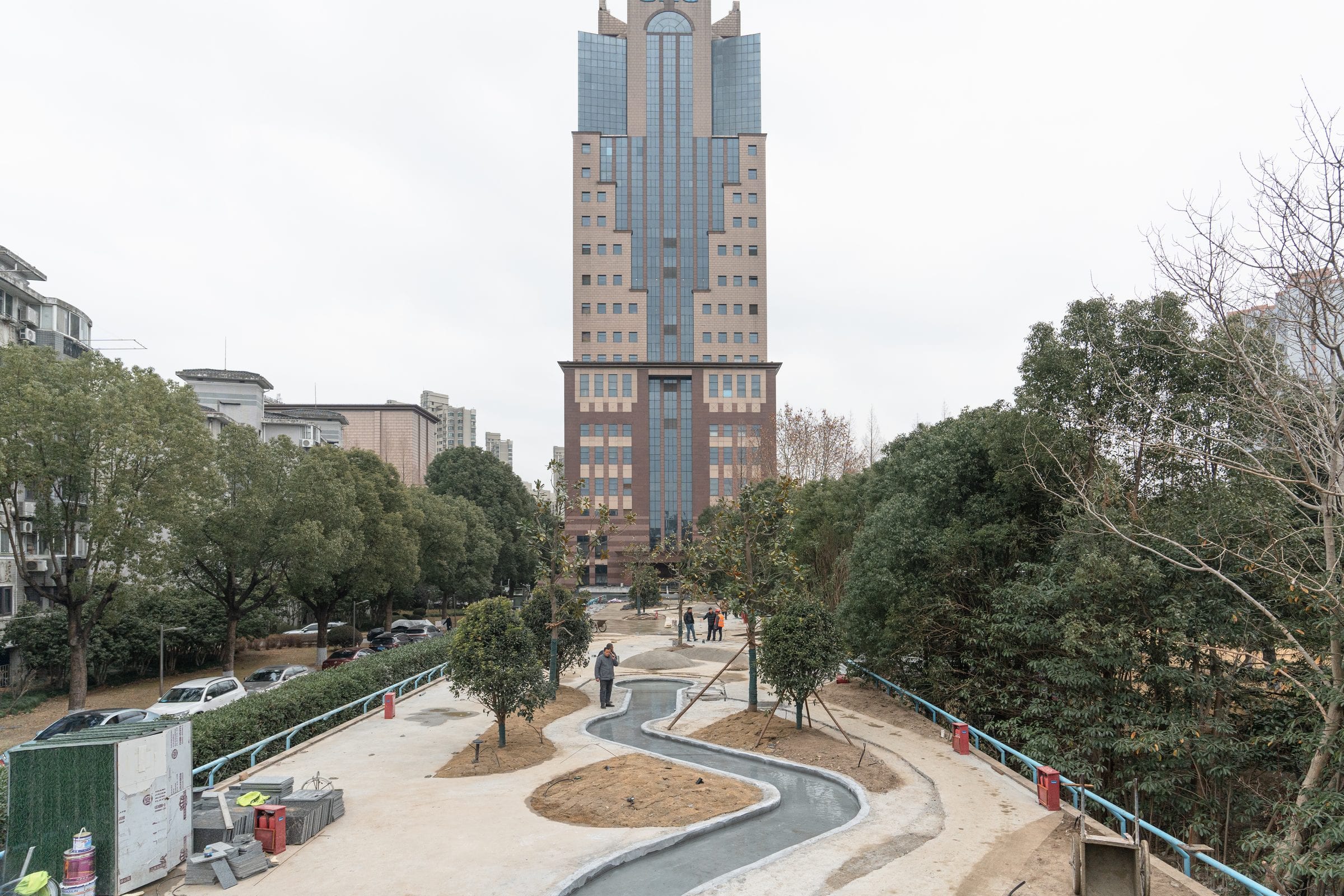 Construction-wide view of the curved deck landscape with a spiral-stair tower