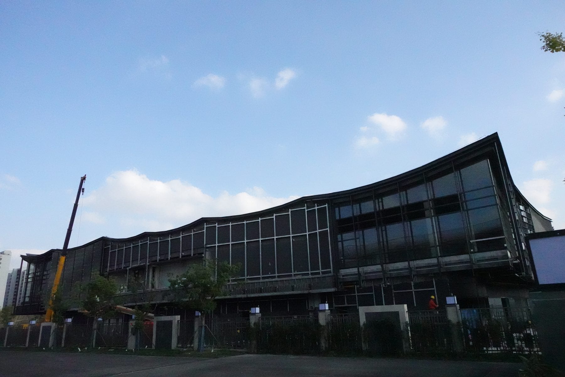 Curved roof and glass elevation of the commercial block, site survey photograph