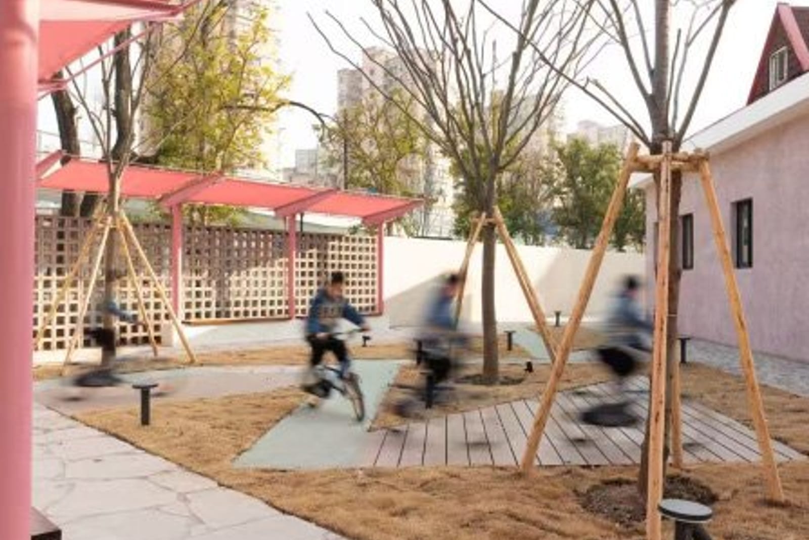 Renovated public space with pink steel canopy and seating