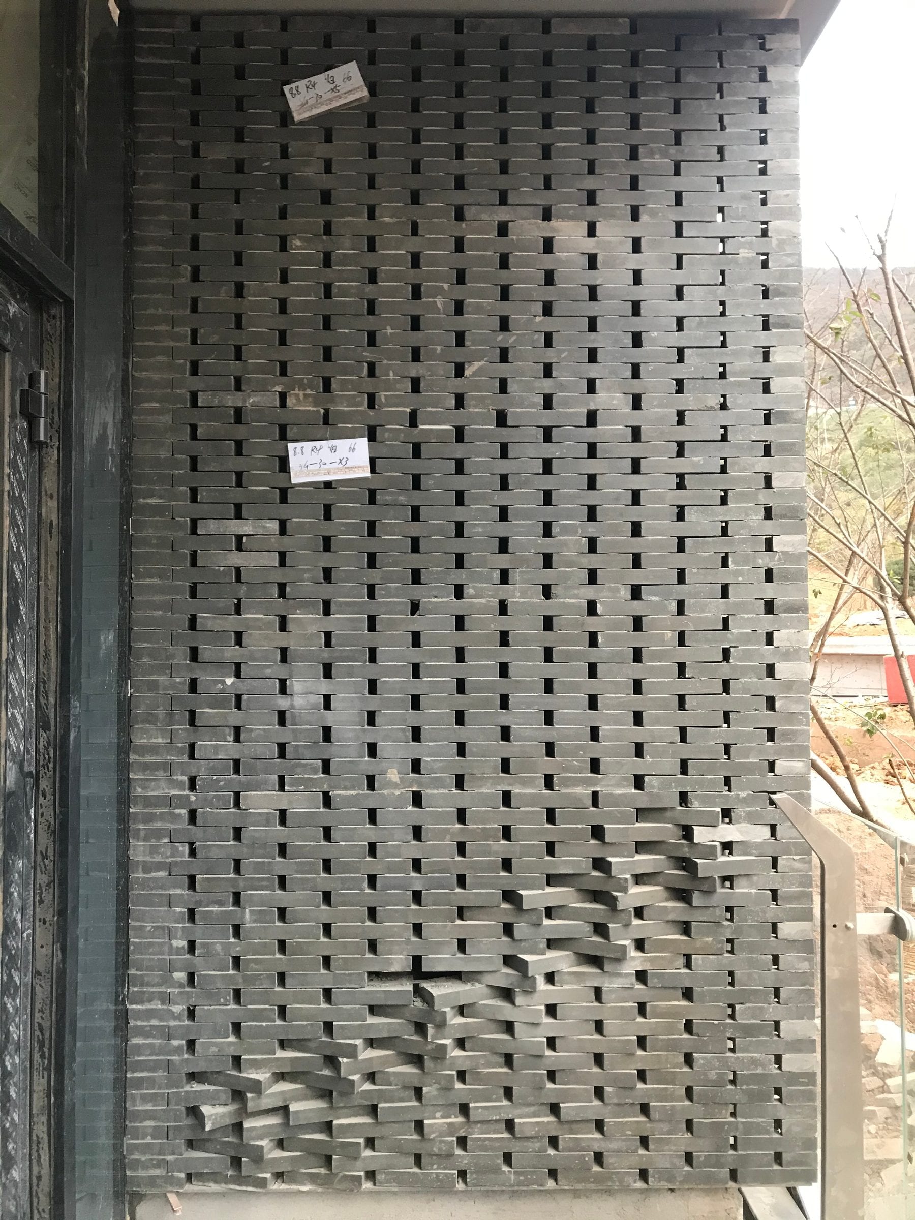 Completed brick screen bay with timber eaves, south tower fourth floor