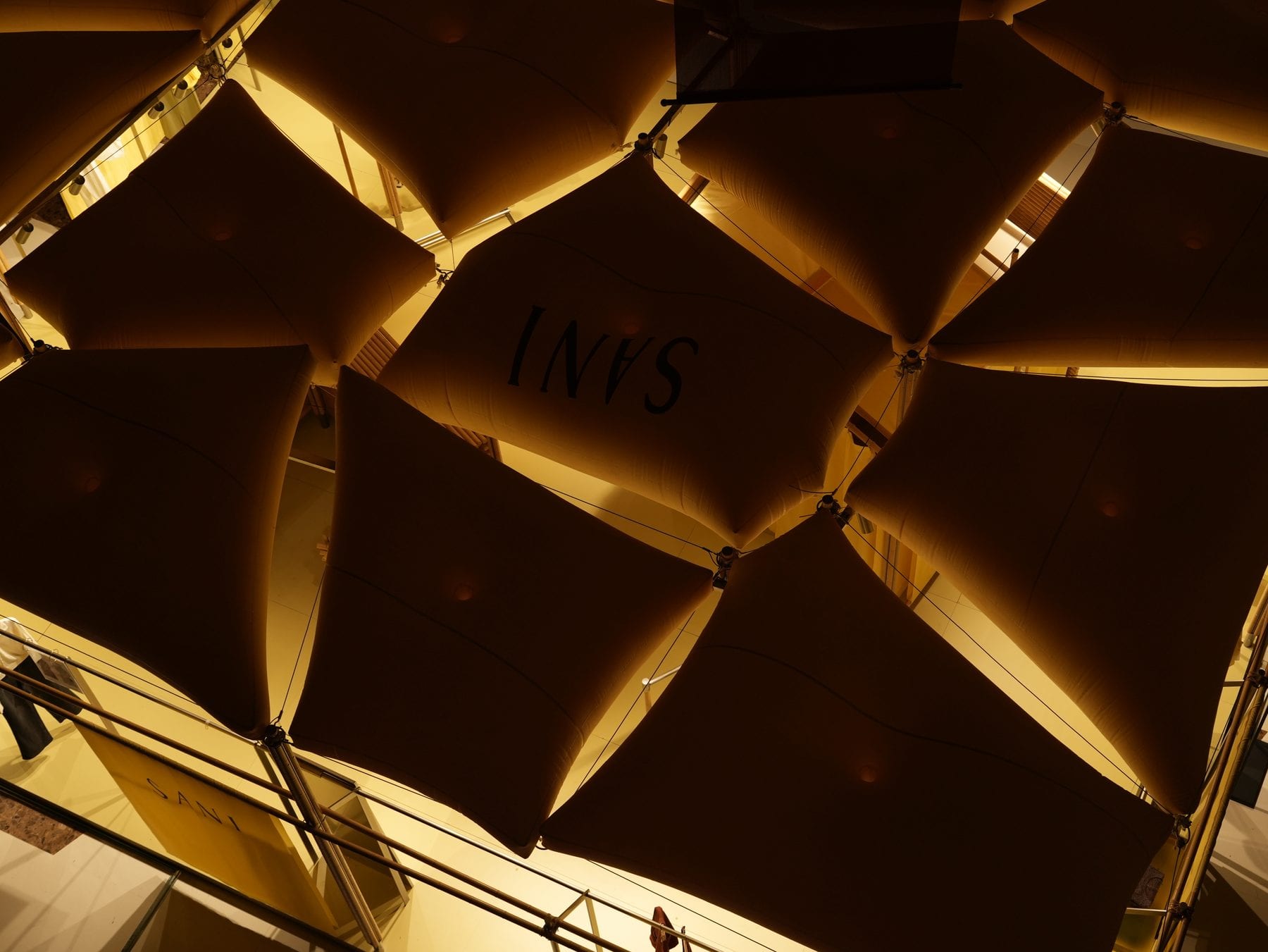 Golden inflatable pillow ceiling with SANI logo