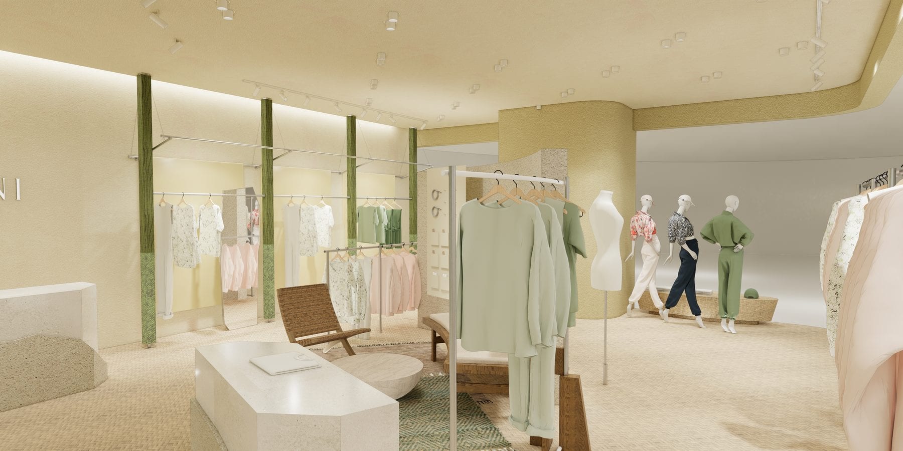 The retail hall between green-wrapped columns