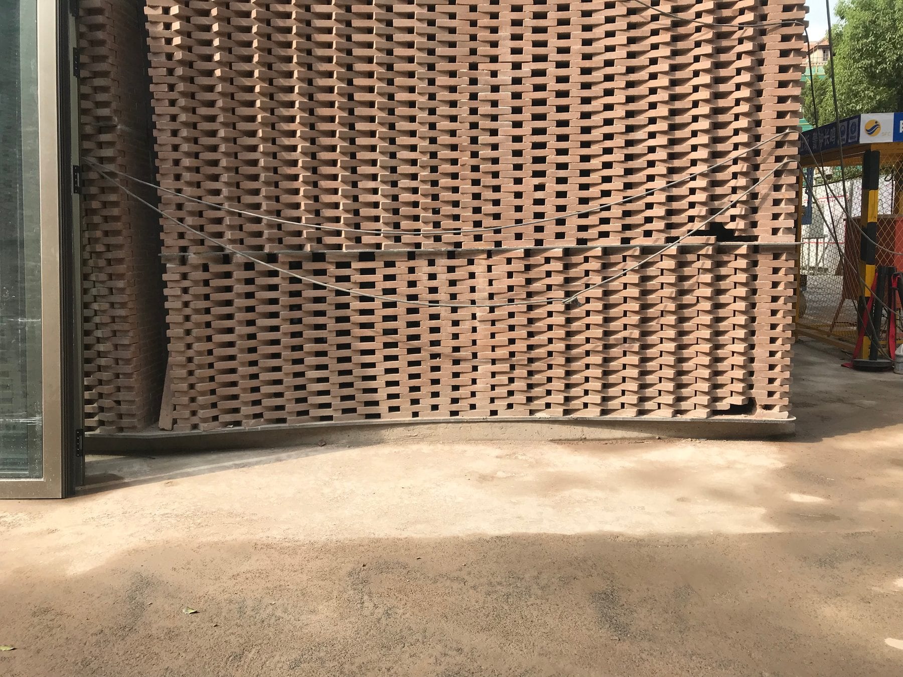 Full-scale woven brick mock-up panel tested outdoors before production