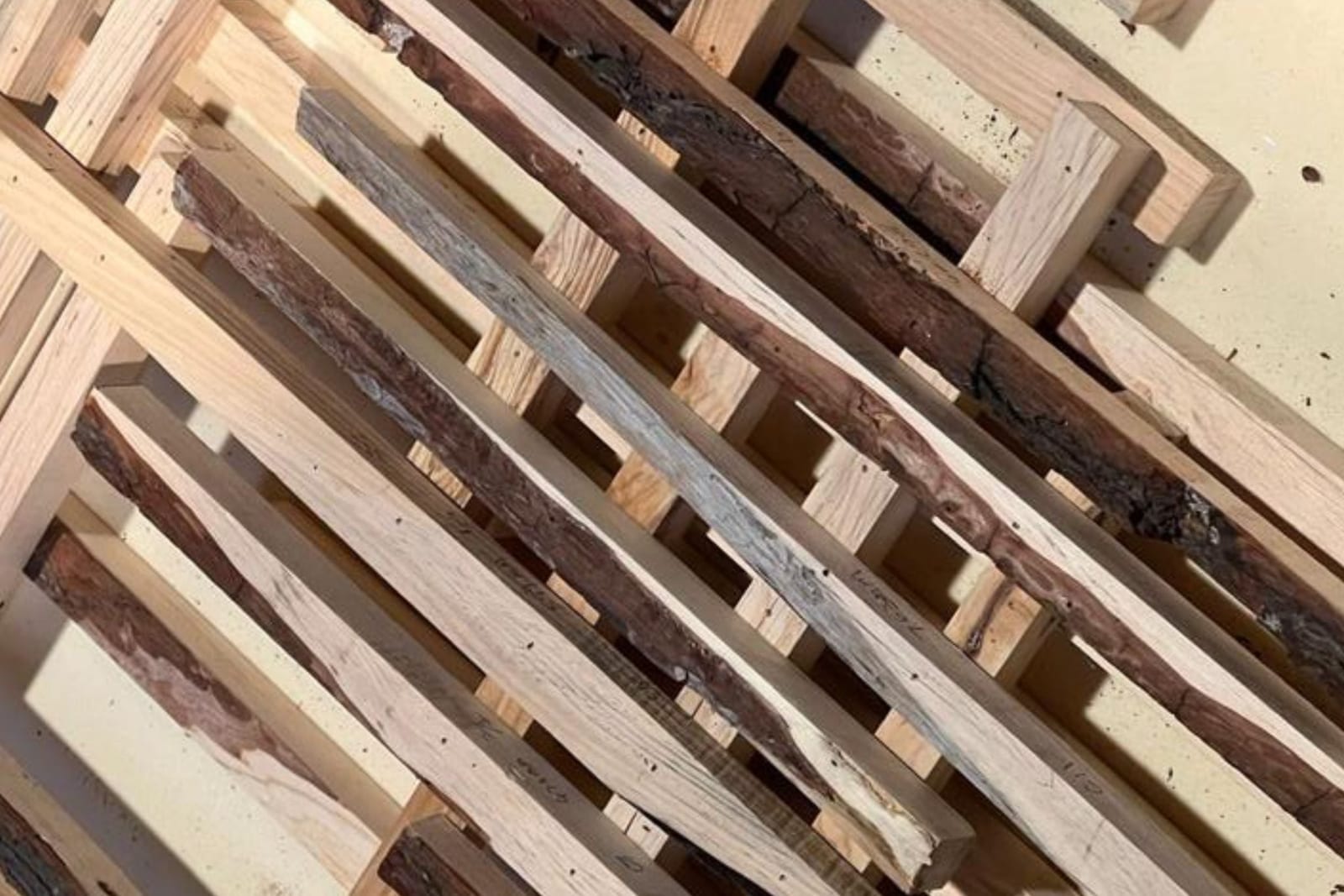 Robotic assembly of wood offcut sticks for the facade system