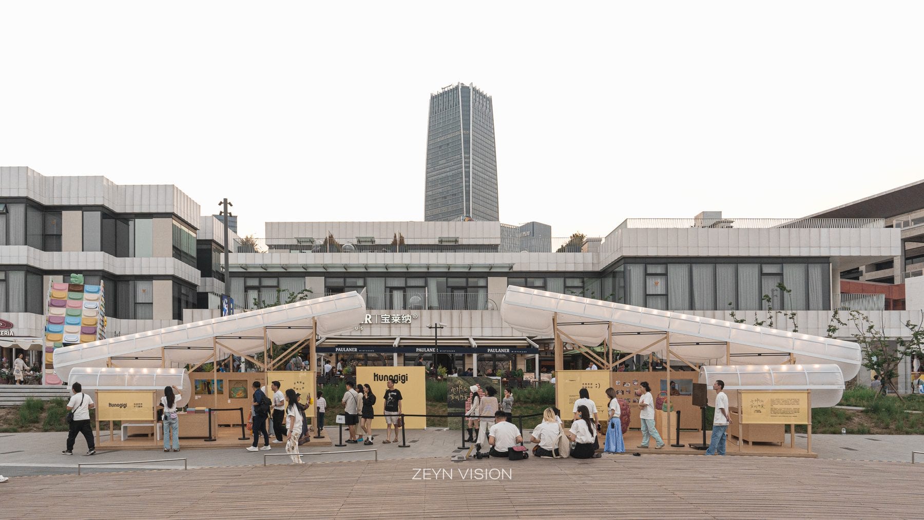 Daytime view of the pavilion pair on the plaza