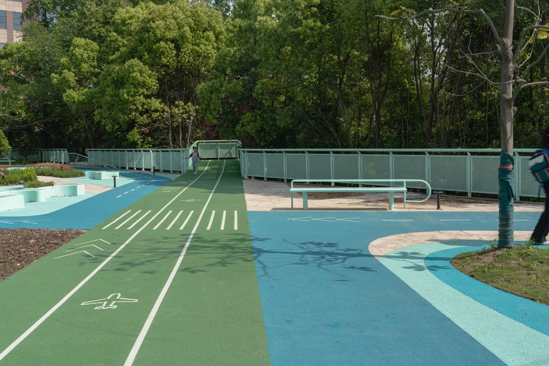 The water channel curving through the site