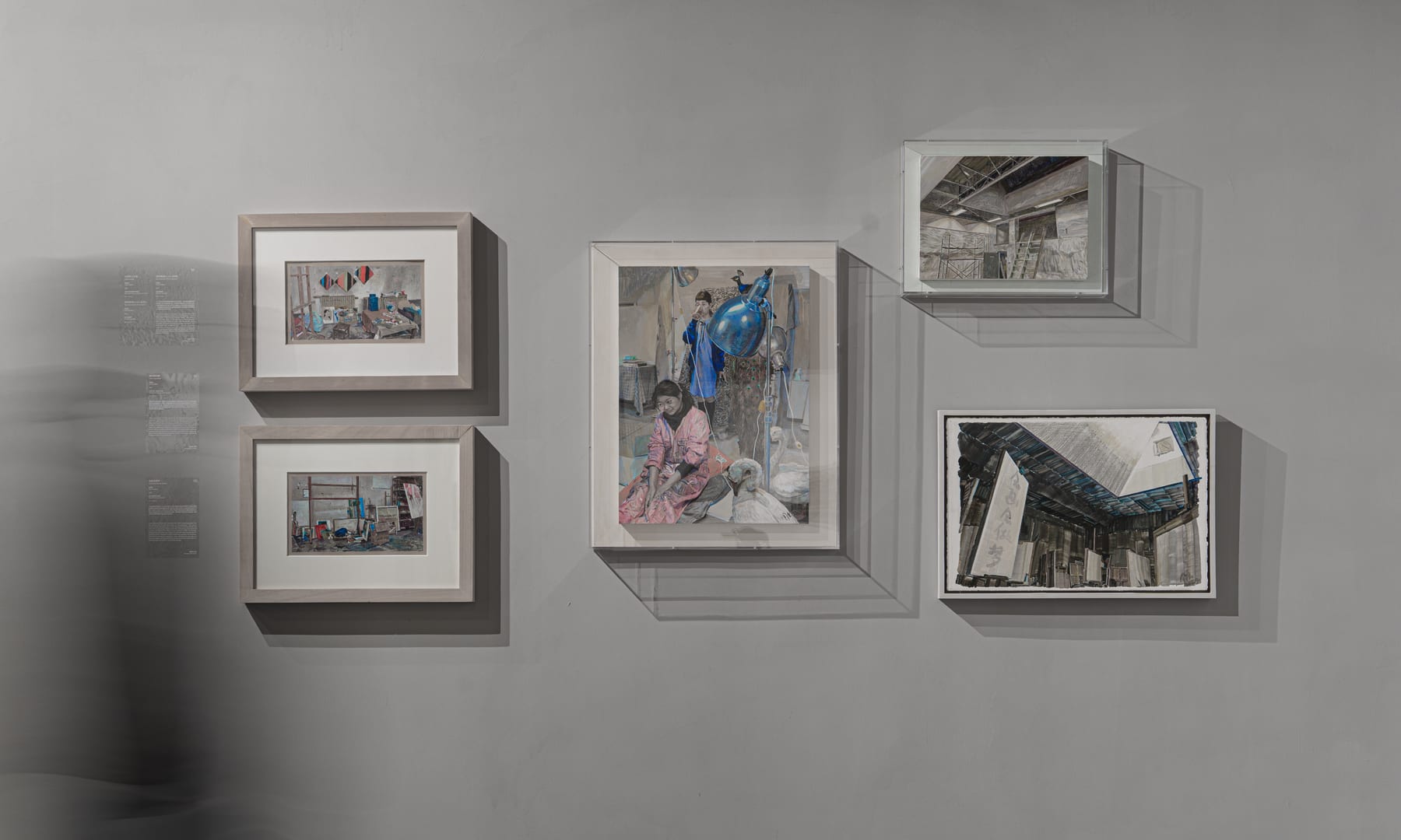 Cluster of framed studies — rooms, scaffolds, a courtyard — with a long-exposure shadow at the wall's edge