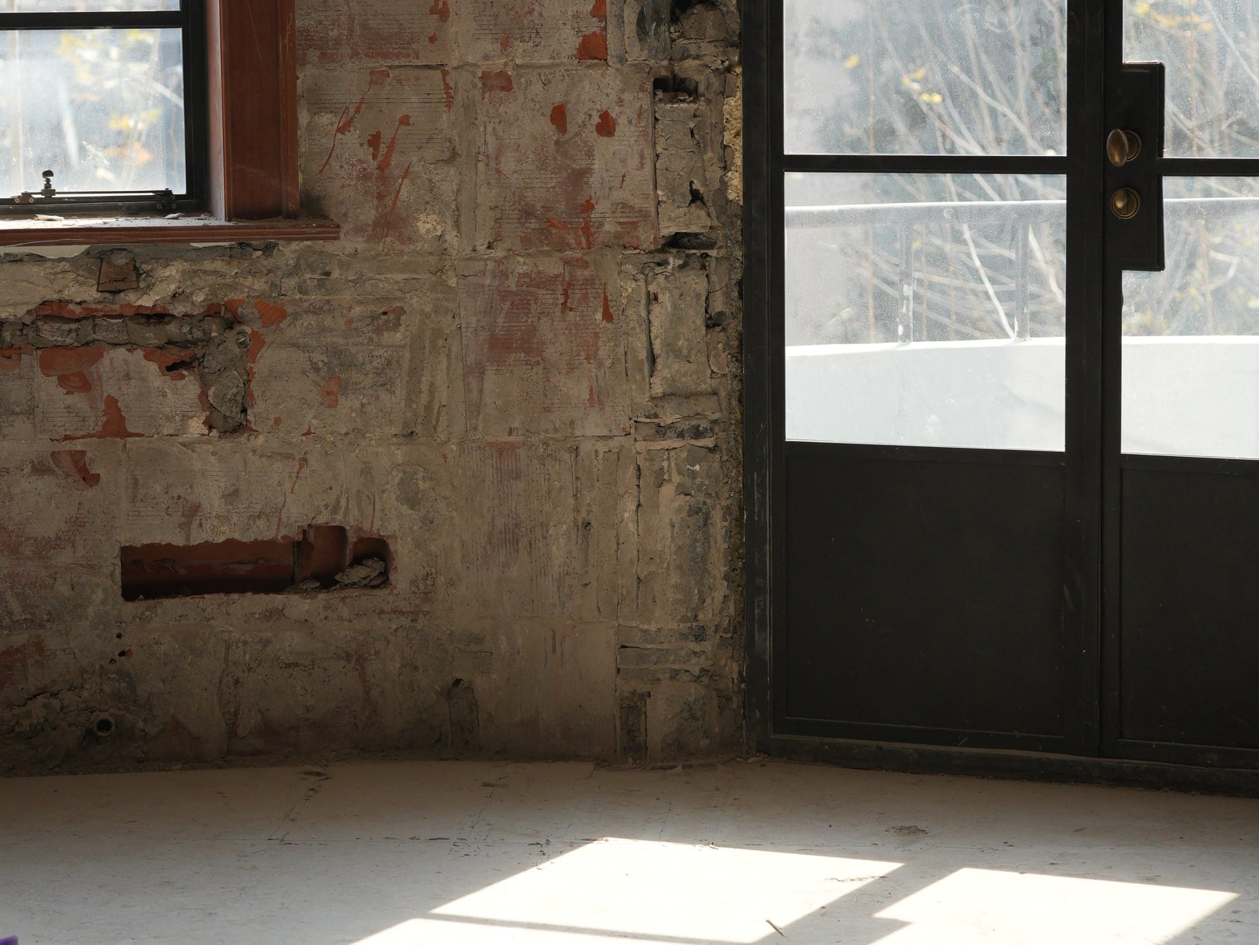 Window light falling across the stripped floor