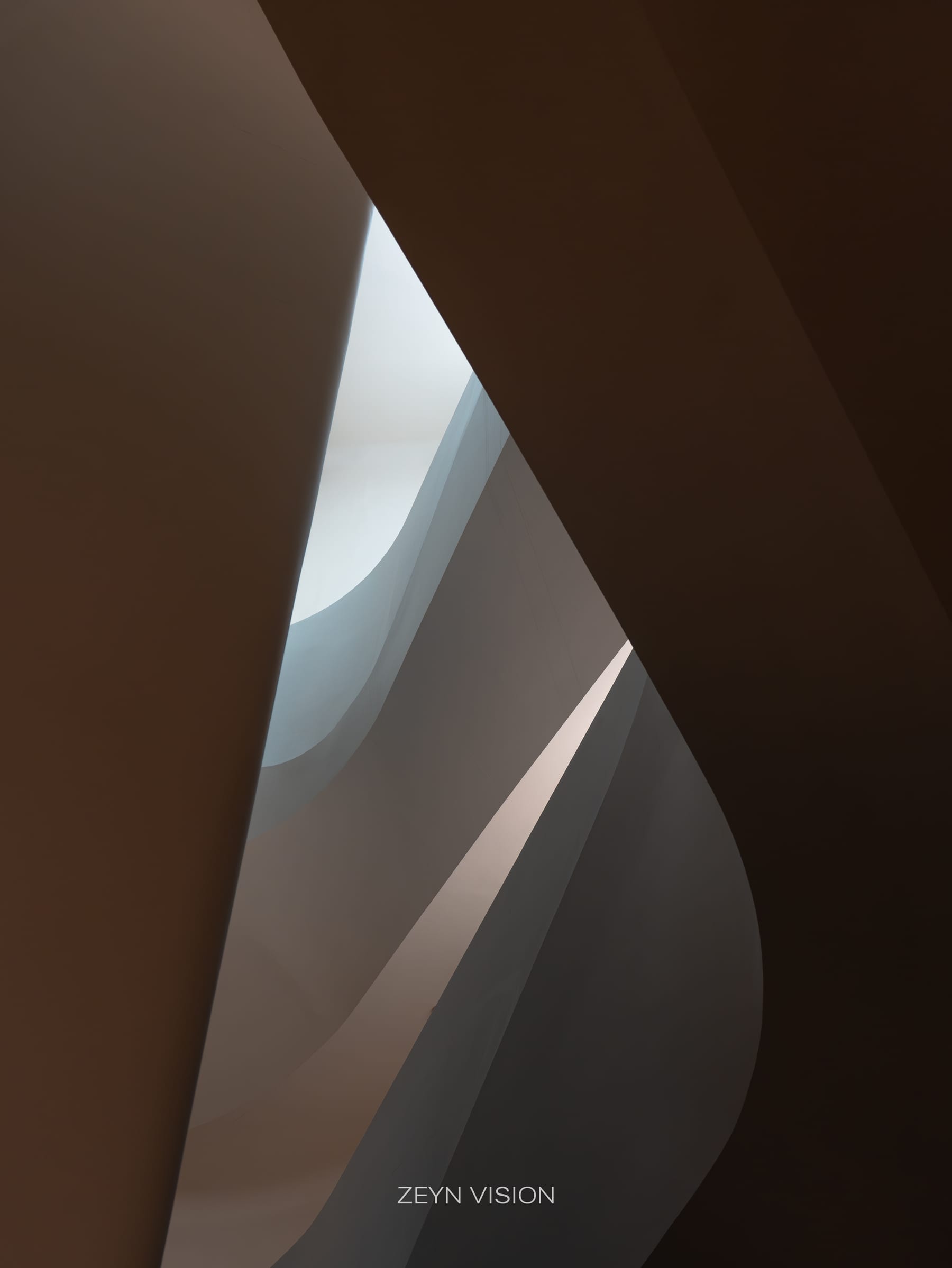 Abstract curves of the white atrium in soft light