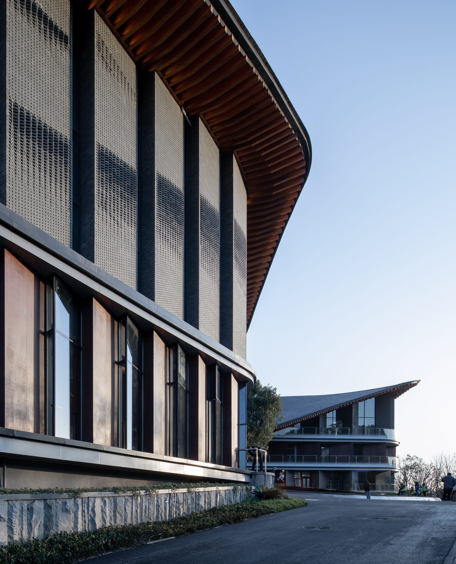 Hotel entrance under the curved timber eave