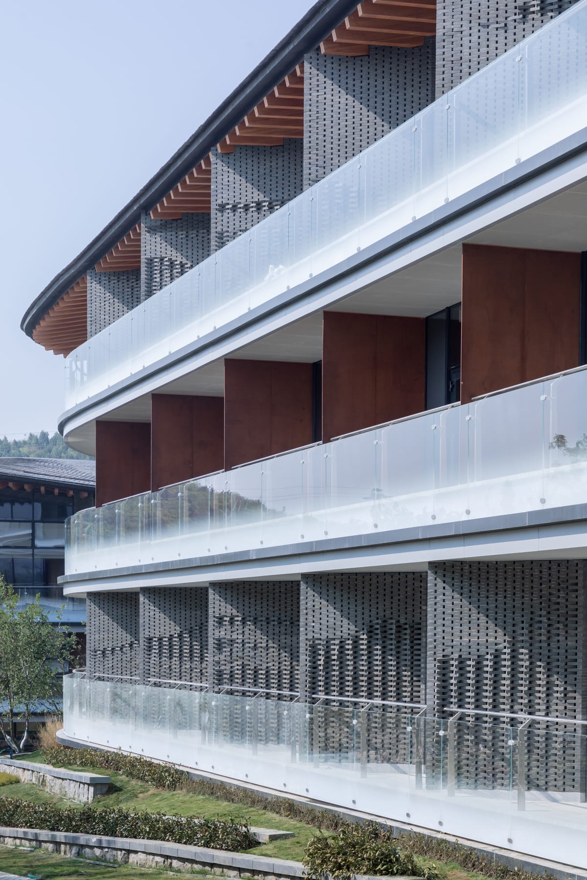 Guestroom balconies behind lattice screens