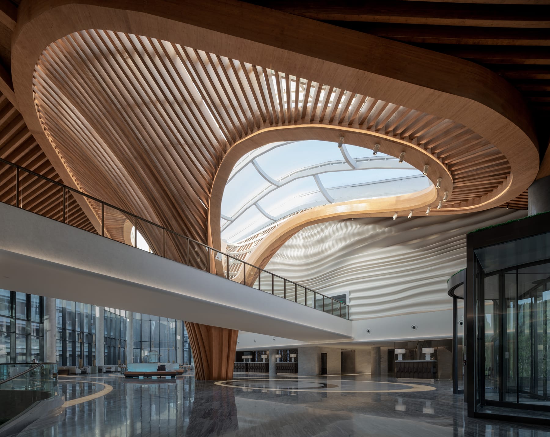 Atrium ceiling woven from timber slats