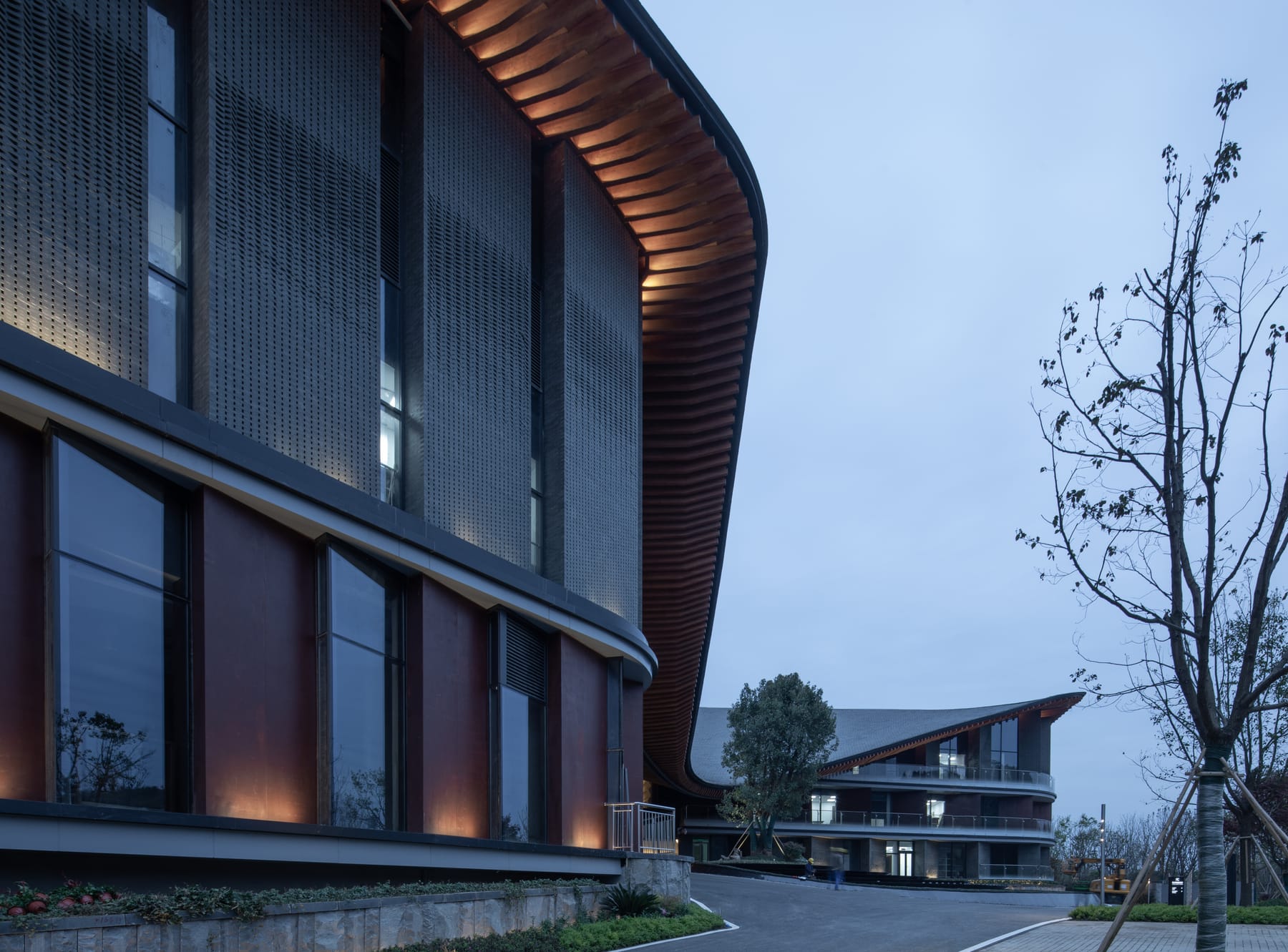 Timber louvers under the eave at blue hour