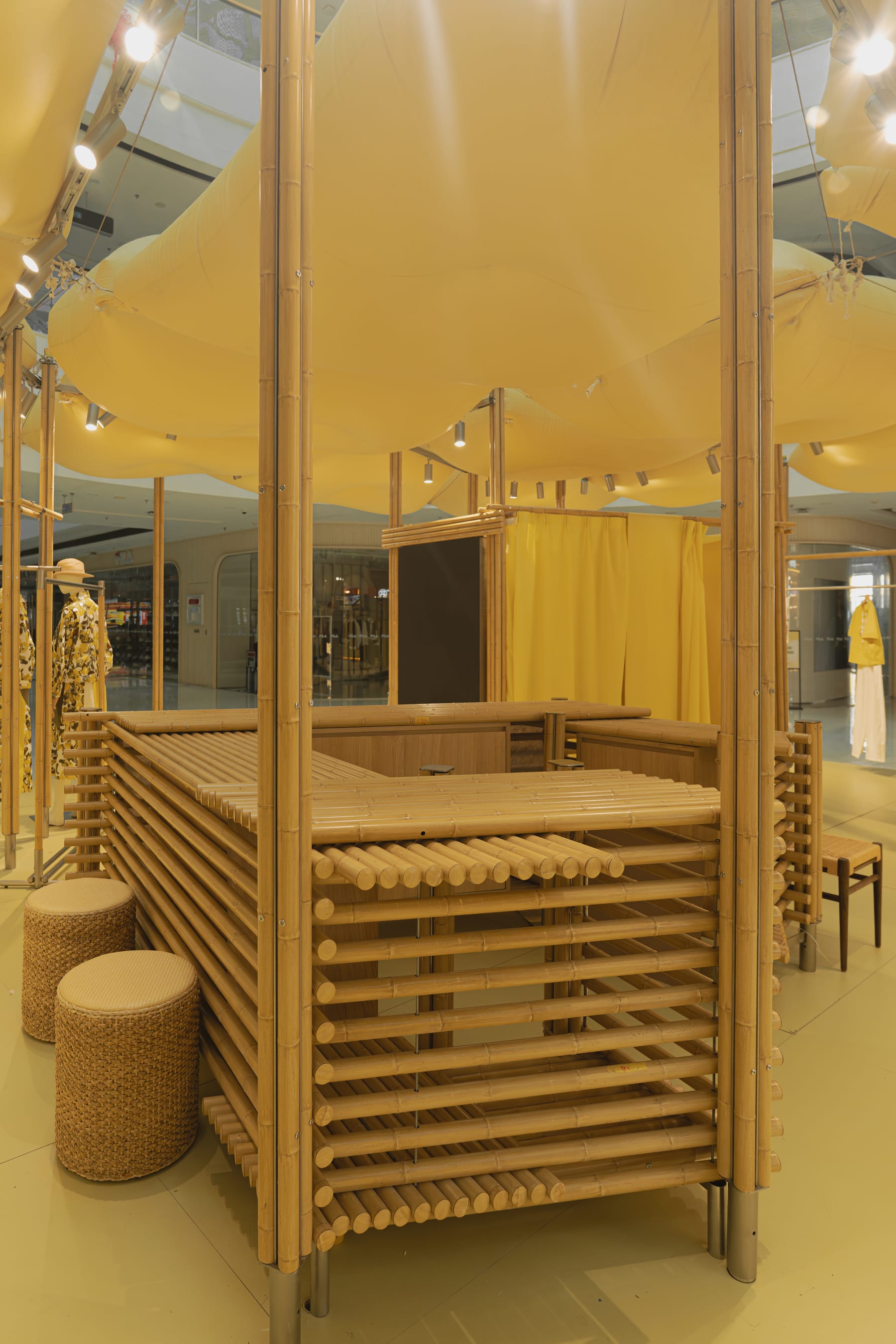 Corner of the bamboo-rod cashier module with woven stools