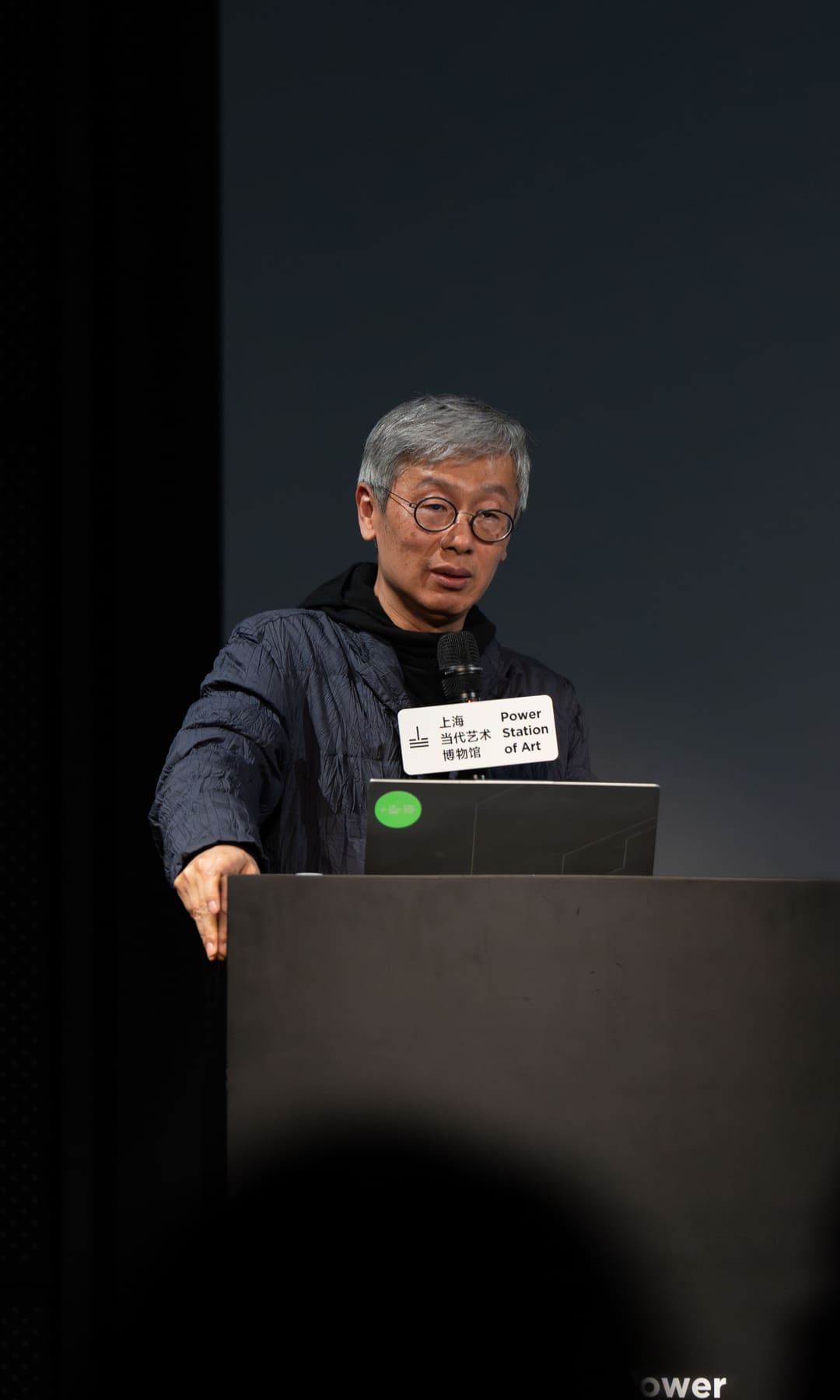 The lecturer gesturing