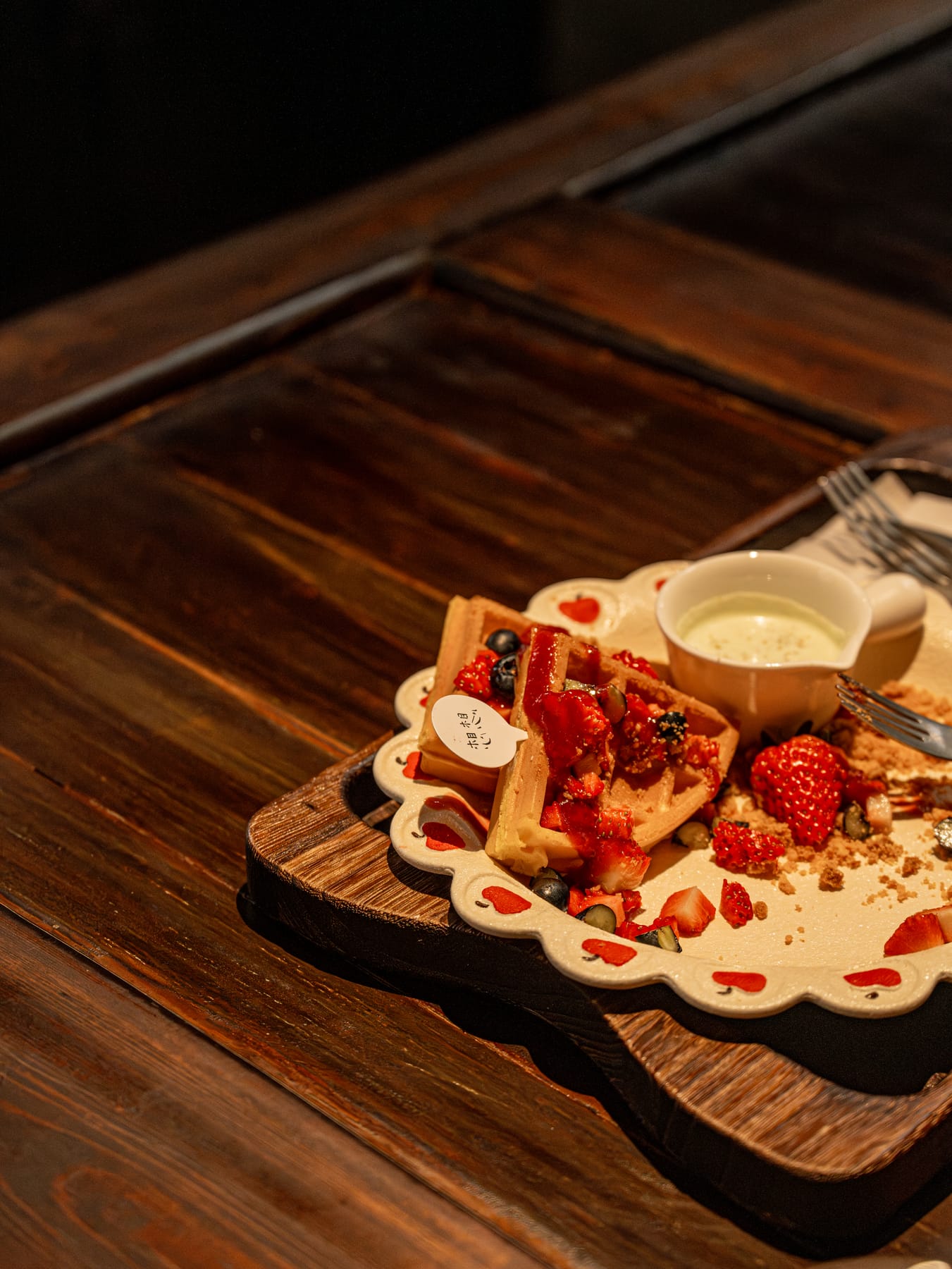 Strawberry waffles on a wooden board