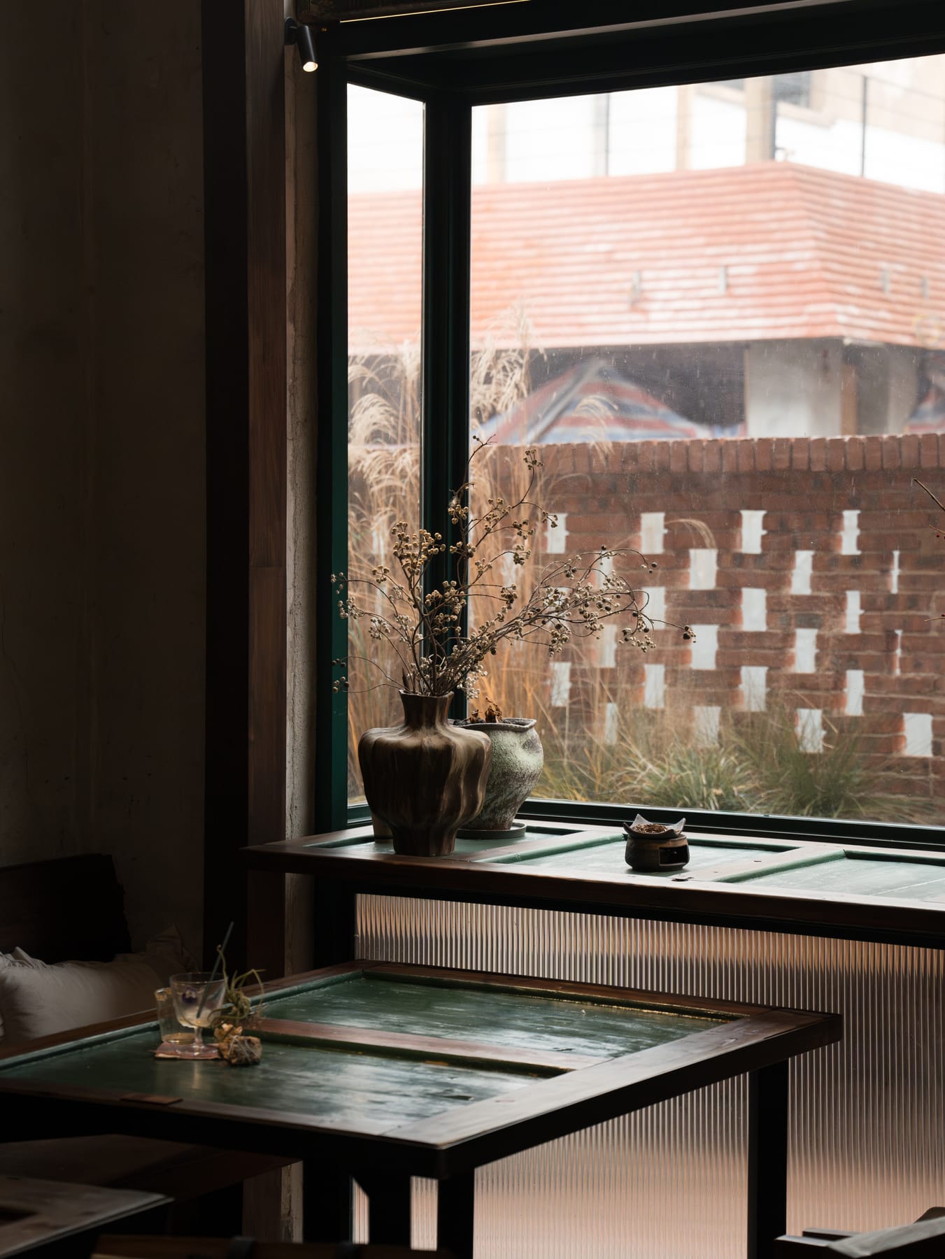Window seat with a red-brick villa outside