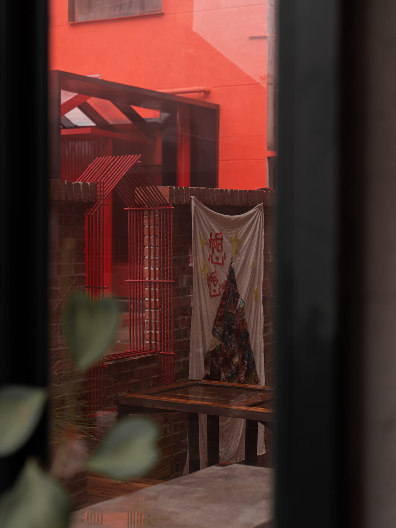 Red-lit corner by the window