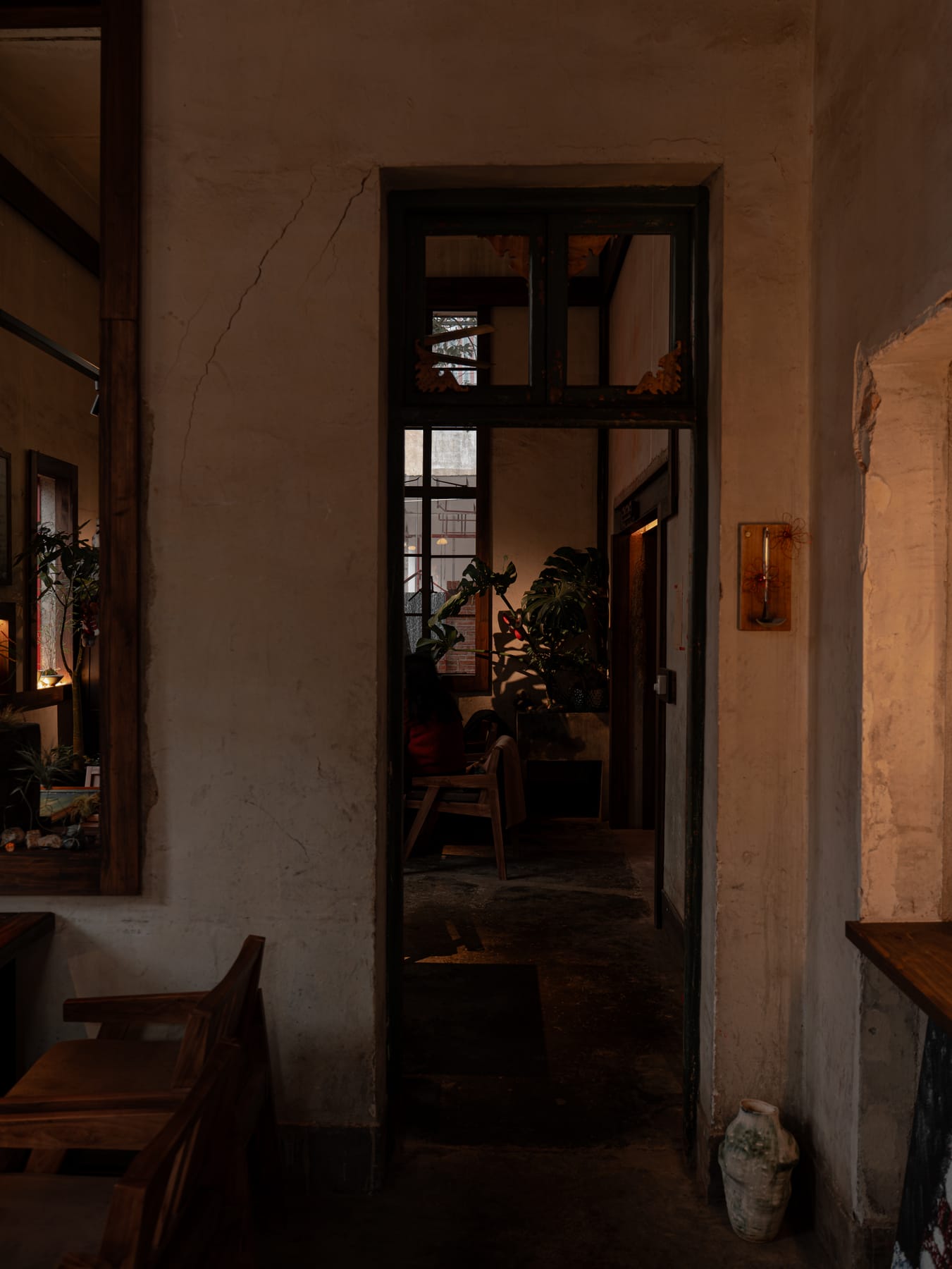 Dark wood doorway into the back room