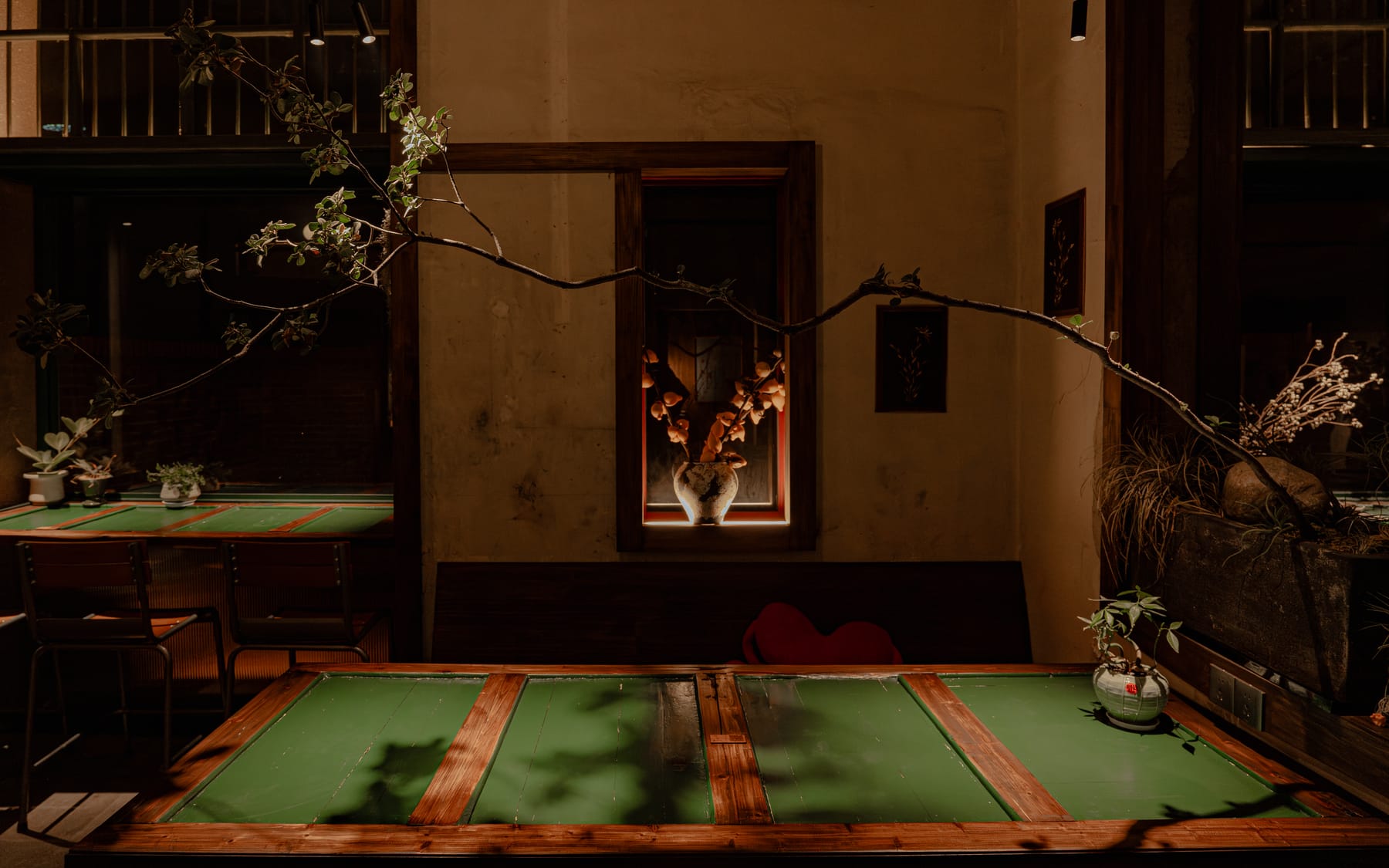 Green stone tables in the dim back room